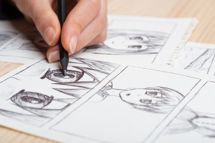 Ilustrasi menggambar komik Artist drawing an anime comic book in a studio.