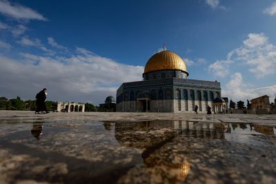 A Palestinian walks in front of the Dome of the Rock on Al-Aqsa compound, also known to Jews as the Temple Mount, in Jerusalem's Old City, February 19, 2024. REUTERS/Ammar Awad