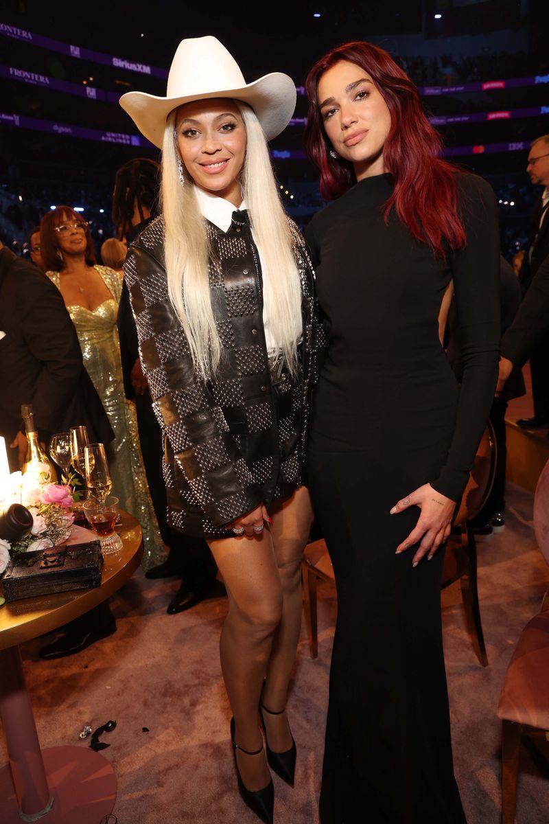 LOS ANGELES, CALIFORNIA - FEBRUARY 04: (L-R) Beyoncé and Dua Lipa attend the 66th GRAMMY Awards at Crypto.com Arena on February 04, 2024 in Los Angeles, California. (Photo by Kevin Mazur/Getty Images for The Recording Academy)