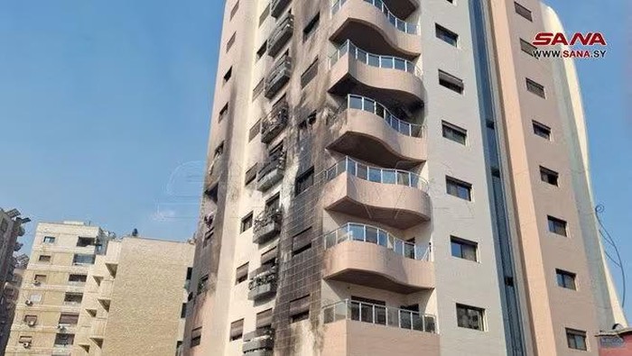 A view shows a damaged building after, according to Syrian state media reports, several Israeli missiles hit a residential building in the Kafr Sousa district, Damascus, Syria February 21, 2024. SANA/Handout via REUTERS Purchase Licensing Rights