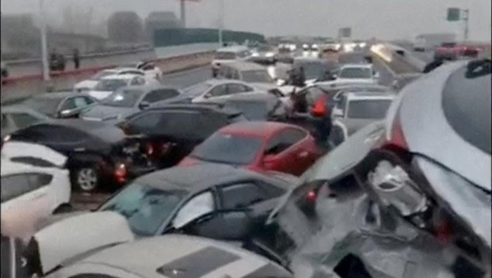 Cars pile up on an overpass during rainy and snowy weather, in Suzhou, Jiangsu, China in this screengrab obtained from a video released on February 23, 2024. Video Obtained By Reuters/via REUTERS THIS IMAGE HAS BEEN SUPPLIED BY A THIRD PARTY NO RESALES. NO ARCHIVES.