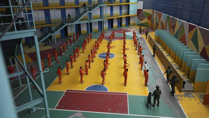 Soldiers escort inmates at the Cotopaxi prison during a press tour organized by the military, in Latacunga, Ecuador, Thursday, Feb. 22, 2024. According to the military, the tour is to demonstrate that control has been regained inside the prisons cross the country. (AP Photo/Dolores Ochoa)