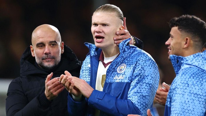 BOURNEMOUTH, ENGLAND - FEBRUARY 24: Pep Guardiola, Manager of Manchester City, embraces Erling Haaland of Manchester City following the Premier League match between AFC Bournemouth and Manchester City at the Vitality Stadium on February 24, 2024 in Bournemouth, England. (Photo by Clive Rose/Getty Images)