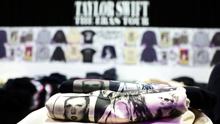 Taylor Swift merchandise t-shirts are seen at a soon-to-be-opened pop-up store ahead of her Eras Tour concert, at the Sands Expo and Convention Centre in Singapore February 28, 2024. REUTERS/Edgar Su