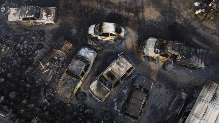 A business was destroyed by the Smokehouse Creek Fire, Thursday, Feb. 29, 2024, in Stinnett, Texas. A wildfire spreading across the Texas Panhandle has become the largest in state history.   (AP Photo/Julio Cortez)