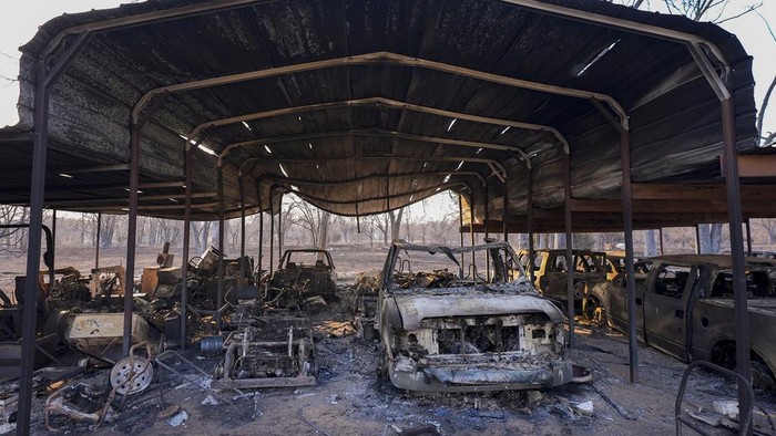 A business was destroyed by the Smokehouse Creek Fire, Thursday, Feb. 29, 2024, in Stinnett, Texas. A wildfire spreading across the Texas Panhandle has become the largest in state history.   (AP Photo/Julio Cortez)