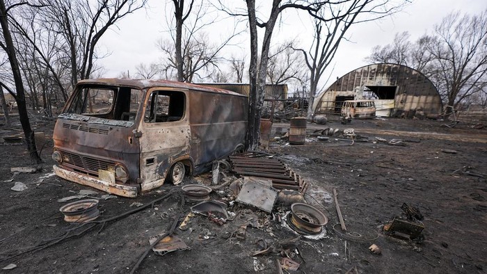 A business was destroyed by the Smokehouse Creek Fire, Thursday, Feb. 29, 2024, in Stinnett, Texas. A wildfire spreading across the Texas Panhandle has become the largest in state history.   (AP Photo/Julio Cortez)