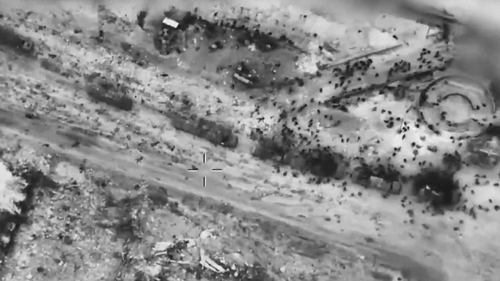 In this screen grab taken from video and released by the Israeli army on Thursday, Feb. 29, 2024, Palestinians surround aid trucks in northern Gaza in what officials described the day before as the first major delivery in a month. (IDF via AP)