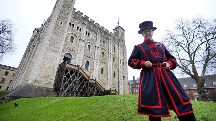 Barney Chandler, newly appointed ravenmaster at The Tower of London in London, Thursday, Feb. 29, 2024. If legend is to be believed, Barney Chandler has just got the most important job in England. Chandler is the newly appointed ravenmaster at the Tower of London. He's responsible for looking after the feathered protectors of the 1,000-year-old fortress. (AP Photo/Kirsty Wigglesworth)