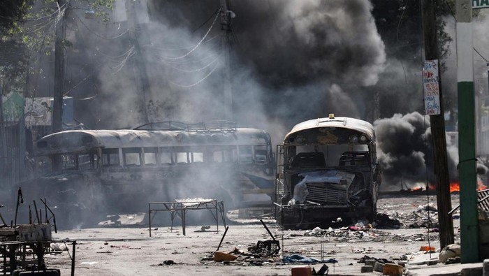 A view shows vehicles damaged by fire during a protest against Prime Minister Ariel Henrys government and insecurity, in Port-au-Prince, Haiti March 1, 2024. REUTERS/Ralph Tedy Erol