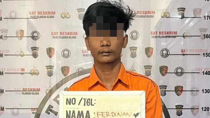 Pelaku Ferdinan Simanjuntak saat berada di kantor polisi. (Polres Pelabuhan Belawan)