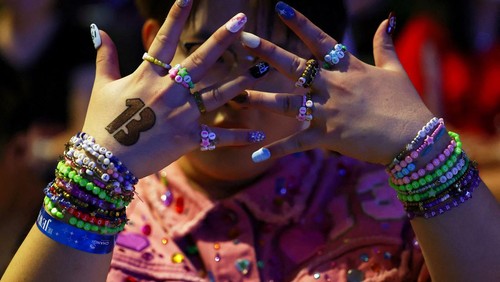 Taylor Swift fans, or Swifties, gather for a sing-a-long ahead of her Eras Tour concert, at Jewel Changi Airport in Singapore March 1, 2024. REUTERS/Edgar Su