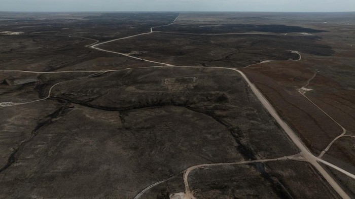 A drone view shows workers with North Plain Electric repairing power lines in the aftermath of the Smokehouse Creek Fire in Canadian, Texas, U.S., March 4, 2024.  REUTERS/Adrees Latif