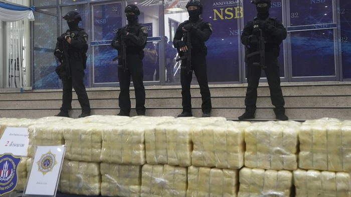 A Thai police officers arranges packages of methamphetamine on a table before a press conference at the Narcotics Suppression Bureau during a news conference in Bangkok, Thailand, Monday, March 4, 2024. Police from Thailand's Narcotics Control Board announced Monday that they had seized a total of 14 million methamphetamine tablets and 1.2 tons of crystal methamphetamine -- 