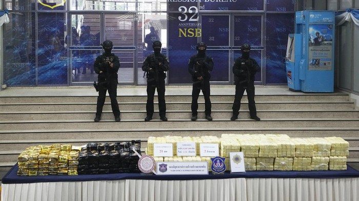 A Thai police officers arranges packages of methamphetamine on a table before a press conference at the Narcotics Suppression Bureau during a news conference in Bangkok, Thailand, Monday, March 4, 2024. Police from Thailand's Narcotics Control Board announced Monday that they had seized a total of 14 million methamphetamine tablets and 1.2 tons of crystal methamphetamine -- 