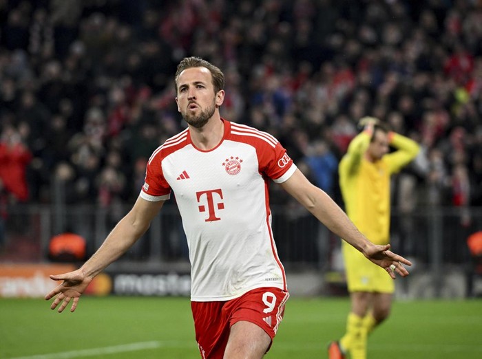 Bayern's Harry Kane celebrates after scoring his side's opening goal during the Champions League round of 16 second leg soccer match between FC Bayern Munich and Lazio at the Allianz Arena stadium in Munich, Germany, Tuesday, March 5, 2024. (Sven Hoppe/DPA via AP)