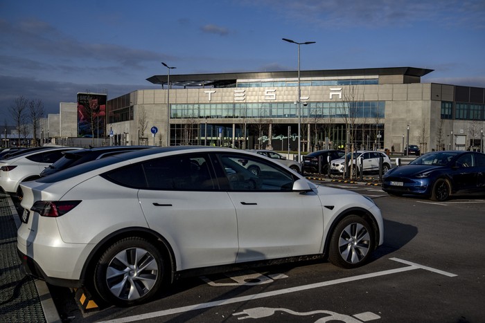 A general view of the Tesla Gigafactory for electric cars in Gruenheide near Berlin, Germany, Tuesday, March 5, 2024. Production at Teslas electric vehicle plant in Germany came to a standstill and workers were evacuated after a power outage that officials suspect was caused by arson. The interior ministry in the state of Brandenburg says unidentified people are suspected of deliberately setting fire to a high-voltage transmission line on a power pylon. (AP Photo/Ebrahim Noroozi)