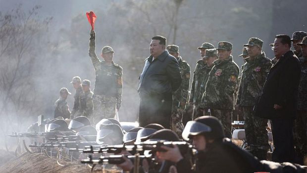 This picture taken on March 6, 2024 and released by North Korea's official Korean Central News Agency (KCNA) on March 7 shows North Korean leader Kim Jong Un (C) inspecting a major operational training base in the western area of the Korean People's Army (KPA) at an undisclosed location in North Korea. (Photo by KCNA VIA KNS / AFP) / - South Korea OUT / ---EDITORS NOTE--- RESTRICTED TO EDITORIAL USE - MANDATORY CREDIT 
