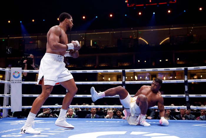 Boxing - Anthony Joshua v Francis Ngannou - Kingdom Arena, Riyadh, Saudi Arabia - March 9, 2024 Anthony Joshua knocks down Francis Ngannou REUTERS/Andrew Couldridge     TPX IMAGES OF THE DAY