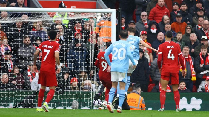 Soccer Football - Premier League - Liverpool v Manchester City - Anfield, Liverpool, Britain - March 10, 2024 Manchester Citys John Stones scores their first goal REUTERS/Carl Recine NO USE WITH UNAUTHORIZED AUDIO, VIDEO, DATA, FIXTURE LISTS, CLUB/LEAGUE LOGOS OR LIVE SERVICES. ONLINE IN-MATCH USE LIMITED TO 45 IMAGES, NO VIDEO EMULATION. NO USE IN BETTING, GAMES OR SINGLE CLUB/LEAGUE/PLAYER PUBLICATIONS.