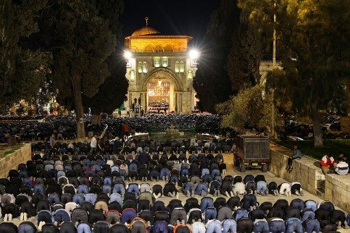 Palestinian Muslim devotees perform an evening prayer known as 'Tarawih' in Jerusalem's al-Aqsa Mosque compound during the holy fasting month of Ramadan, on March 11, 2024, amid ongoing battles between Israel and the militant group Hamas. (Photo by AHMAD GHARABLI / AFP)