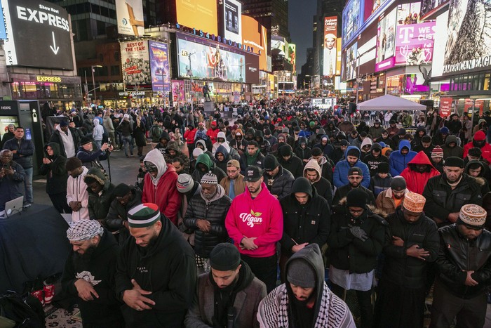 Members of the Muslim community gather for the Taraweeh prayer during a month of Ramadan at New Yorks Times Square, Sunday, March 10, 2024. (AP Photo/Yuki Iwamura)