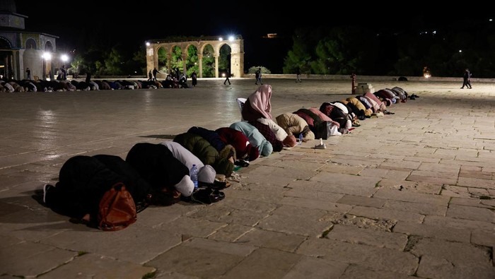 Muslim worshippers take part in the evening 'Tarawih' prayers during of the Muslim holy month of Ramadan, at Al-Aqsa compound, known to Jews as Temple Mount, in Jerusalem’s Old City March 10, 2024. REUTERS/Ammar Awad