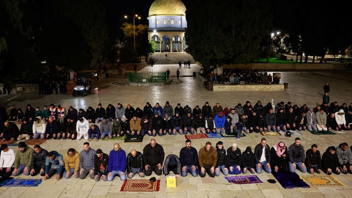 Muslim worshippers take part in the evening 'Tarawih' prayers during of the Muslim holy month of Ramadan, at Al-Aqsa compound, known to Jews as Temple Mount, in Jerusalem’s Old City March 10, 2024. REUTERS/Ammar Awad