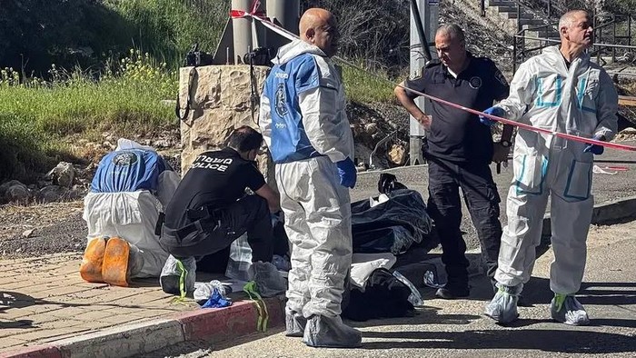 Israeli forces work at the scene of a suspected attack at a checkpoint outside of Jerusalem, in the Israeli-occupied West Bank, on March 13, 2024. (Reuters)