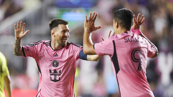 Mar 13, 2024; Fort Lauderdale, FL, USA;  Inter Miami CF forward Lionel Messi (10) celebrates after scoring a goal with forward Luis Suarez (9) against the Nashville SC in the first half during the Concacaf round of sixteen at Chase Stadium. Mandatory Credit: Nathan Ray Seebeck-USA TODAY Sports