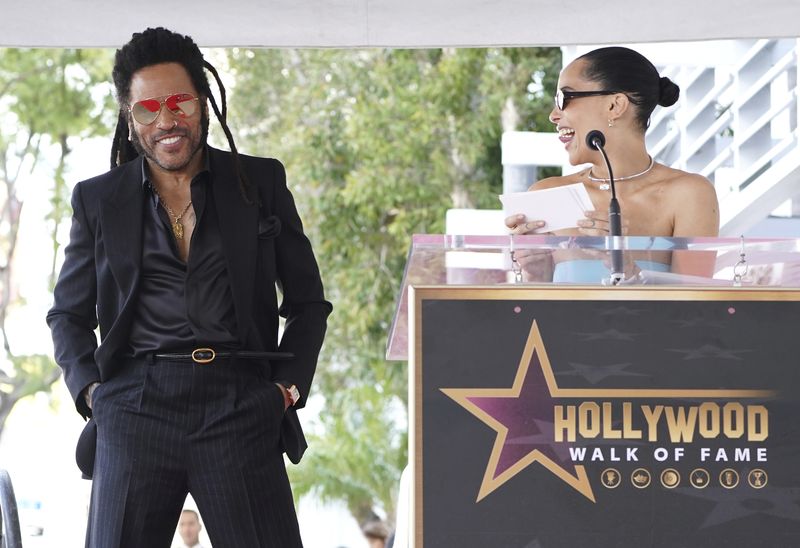 Zoe Kravitz, right, speaks at a ceremony honoring Lenny Kravitz, left, with a star on the Hollywood Walk of Fame on Tuesday, March 12, 2024, in Los Angeles. (Photo by Jordan Strauss/Invision/AP)
