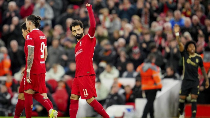 Liverpools Mohamed Salah celebrates after scoring his sides third goal during the Europa League round of 16, second leg, soccer match between Liverpool and Sparta Praha at Anfield Stadium, Liverpool, England, Thursday March 14, 2024. (AP Photo/Jon Super)