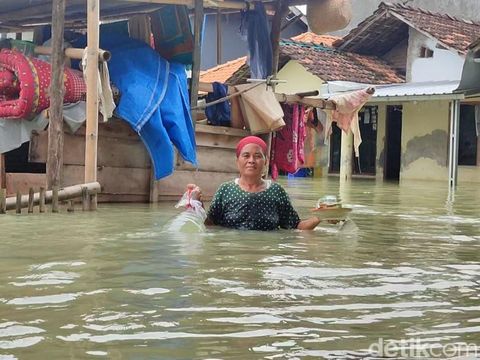 Banjir di Dukuh Cangkring Pos, Desa Cangkring, Kecamatan Karanganyar, Kabupaten Demak, Minggu (17/3/2024) sore.