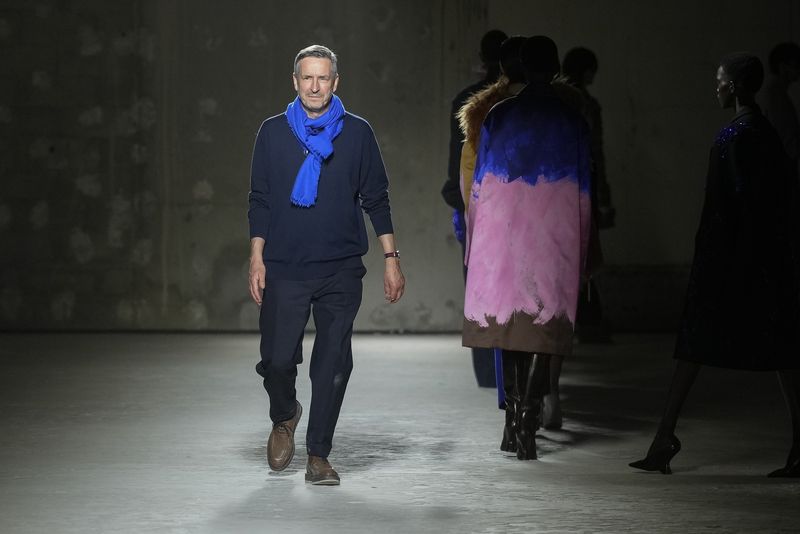 Designer Dries Van Noten accepts applause after his Fall/Winter 2024-2025 ready-to-wear collection presented Wednesday, Feb. 28, 2024 in Paris. (Photo by Scott A Garfitt/Invision/AP)