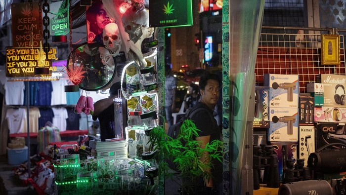 People smoke out of bongs during a speed contest to finish 3 grams, at the Green Party in Bangkok, Thailand, October 7, 2023. REUTERS/Jorge Silva TPX IMAGES OF THE DAY