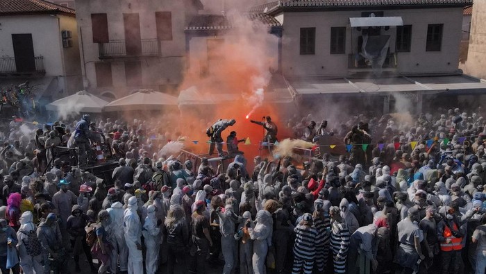 Revellers participate in a colourful 
