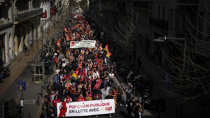 Public sector workers march during a demonstration in Marseille, southern France, Tuesday, March 19, 2024. (AP Photo/Daniel Cole)