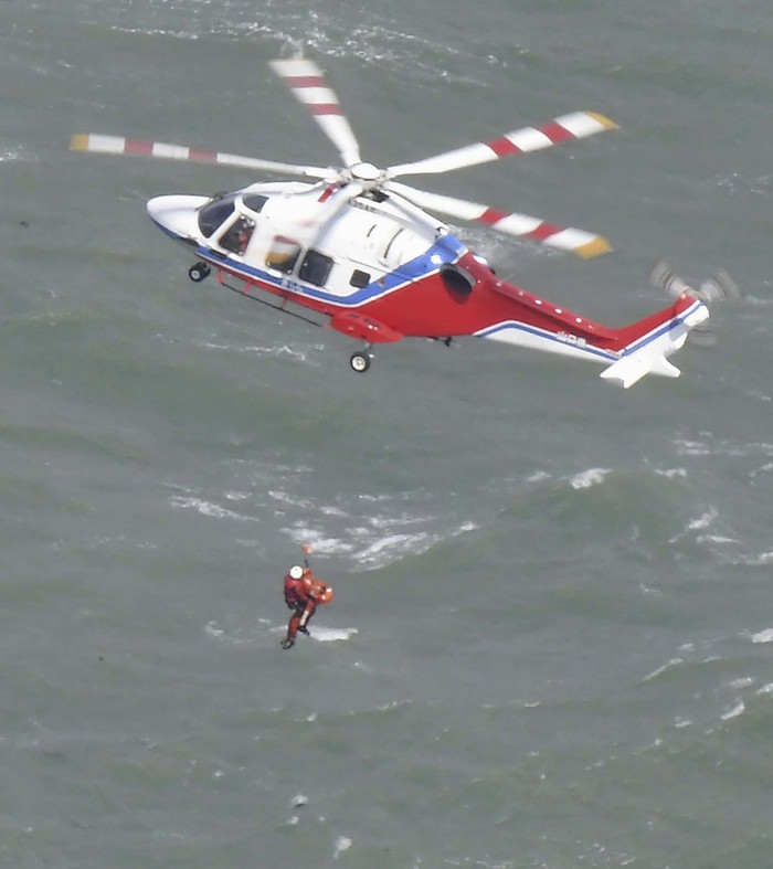 Kapal Tanker Membawa 8 WNI Terbalik di Perairan Jepang A rescue operation is conducted as a South Korean tanker capsized off Shimonoseki, Yamaguchi prefecture, southwestern Japan Wednesday, March 20, 2024. The coast guard said it received a distress call from the Keoyoung Sun chemical tanker, saying that it was tilting while taking refuge near Japan's Mutsure Island due to rough weather. (Kyodo News via AP)
