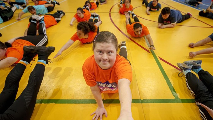 A woman with Down Syndrome takes part in a sports demonstration marking the upcoming World Down Syndrome Day, in Bucharest, Romania, Tuesday, March 19, 2024. (AP Photo/Andreea Alexandru)