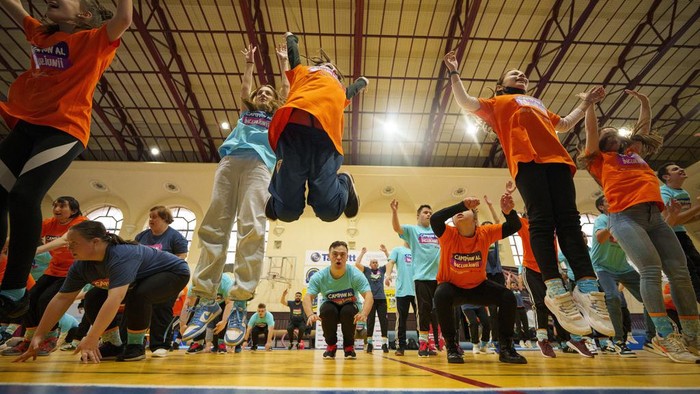 A woman with Down Syndrome takes part in a sports demonstration marking the upcoming World Down Syndrome Day, in Bucharest, Romania, Tuesday, March 19, 2024. (AP Photo/Andreea Alexandru)