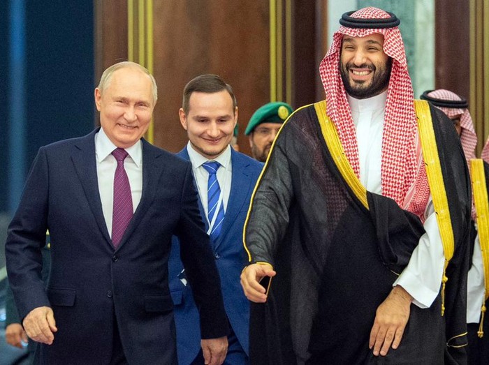 This handout picture provided by the Saudi Press Agency (SPA) shows Saudi Crown Prince Mohammed bin Salman (R) walking with Russian President Vladimir Putin during a welcoming ceremony in the capital Riyadh on December 6, 2023. Russian President Vladimir Putin arrived in Saudi Arabia on December 6 after visiting the United Arab Emirates, making a rare trip abroad as Moscow seeks to reassert itself on the global stage. (Photo by SPA / AFP) / RESTRICTED TO EDITORIAL USE - MANDATORY CREDIT AFP PHOTO / SPA - NO MARKETING NO ADVERTISING CAMPAIGNS - DISTRIBUTED AS A SERVICE TO CLIENTS