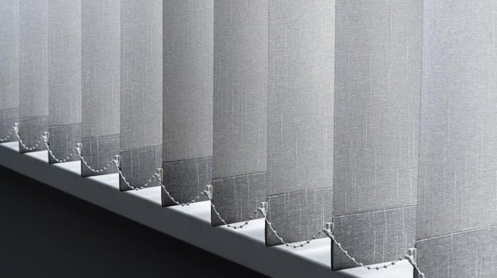 Close-up view of fabric curtain made of dense fabric in the corpora office. Textured abstract backgrounds and wallpapers. Materials and textiles