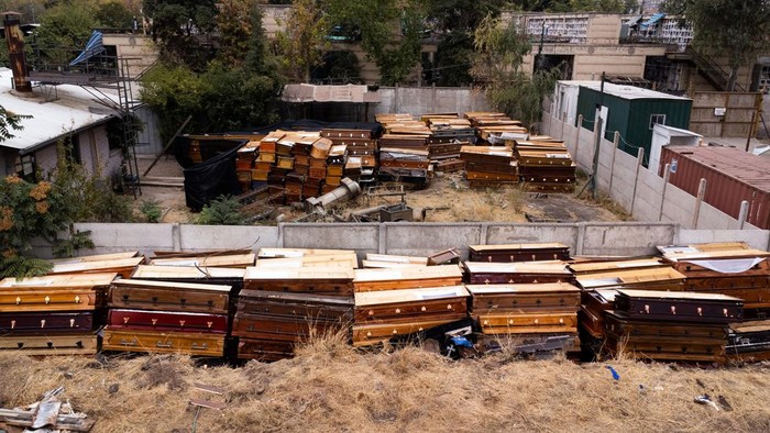 A drone view shows remains of used caskets among garbage at Santiago's General Cemetery, Chile, March 20, 2024. REUTERS/Ivan Alvarado