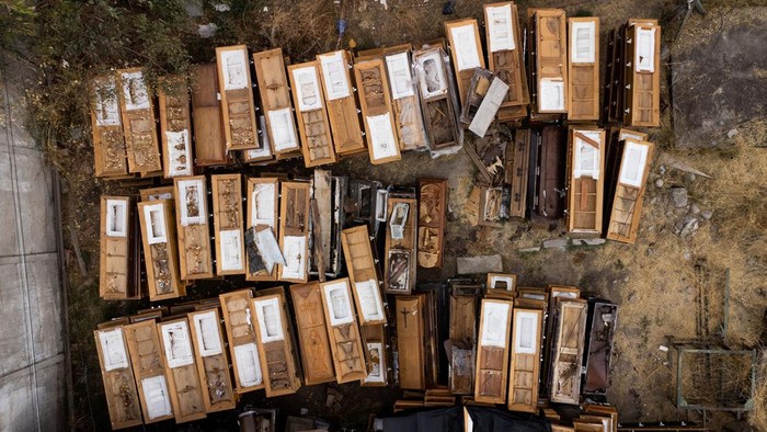 A drone view shows remains of used caskets among garbage at Santiago's General Cemetery, Chile, March 20, 2024. REUTERS/Ivan Alvarado