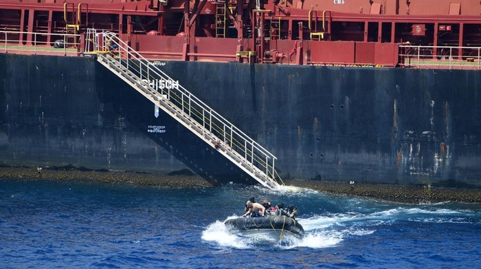 Pirates detained by the Indian navy during a rescue operation for the hijacked ship MV Ruen sit on the deck in this handout image released on March 16, 2024. Spokespersonnavy via X/Handout via REUTERS    THIS IMAGE HAS BEEN SUPPLIED BY A THIRD PARTY. NO RESALES. NO ARCHIVES. MANDATORY CREDIT.