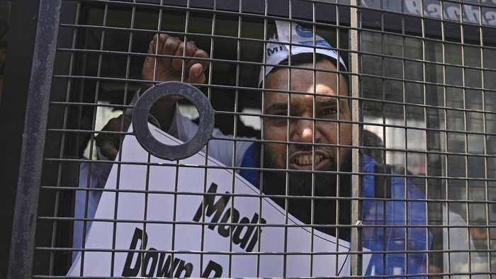 Supporters of Aam Admi Party, or Common Man's Party, hold placards and shout slogans during a protest against the arrest of their party leader Arvind Kejriwal, in Hyderabad, India, Friday, March 22, 2024.  Supporters of an anti-corruption crusader and one of India's most consequential politicians of the last decade in India held protests Friday against his arrest, which opposition parties say is part of a crackdown by Prime Minister Narendra Modi's government before national elections. (AP Photo/Mahesh Kumar A.)