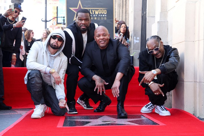 Produser Hip-Hop Dr. Dre Dapat Penghargaan Hollywood Walk of Fame Eminem, Curtis 50 Cent Jackson, and Snoop Dogg pose with Dr. Dre during the unveiling ceremony of his star on the Hollywood Walk of Fame in Los Angeles, California, U.S., March 19, 2024. REUTERS/Mario Anzuoni TPX IMAGES OF THE DAY