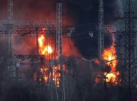 Smoke and fire are seen around high-voltage lines at a site of a Russian missile strike, amid Russia's attack on Ukraine, outside Kharkiv, Ukraine March 22, 2024. REUTERS/Sofiia Gatilova