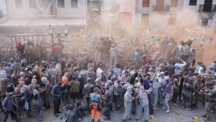 Revellers participate in a colourful 