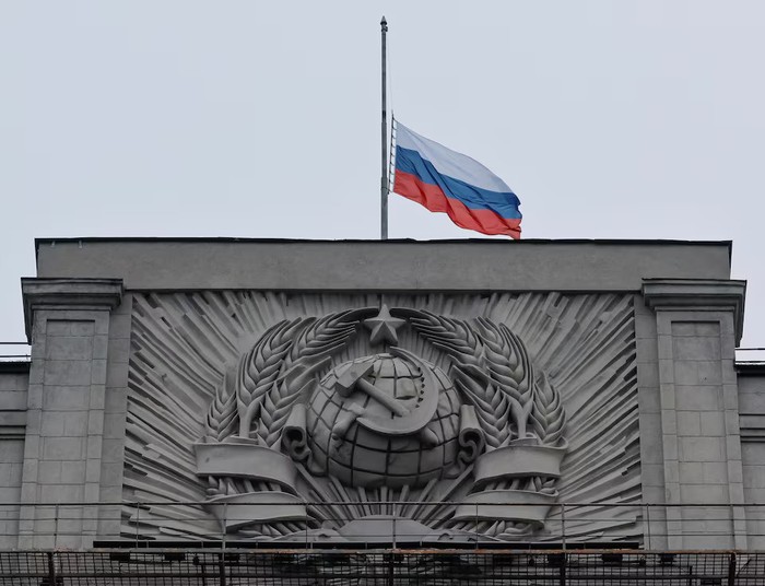 A Russian national flag is seen lowered on the headquarters of State Duma, the lower house of parliament, on the day of mourning, declared following a deadly shooting in the Crocus City Hall concert hall, in Moscow, Russia March 24, 2024. REUTERS/Shamil Zhumatov Purchase Licensing Rights